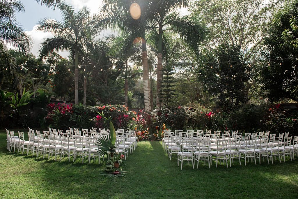 Ceremony setup with white chairs
