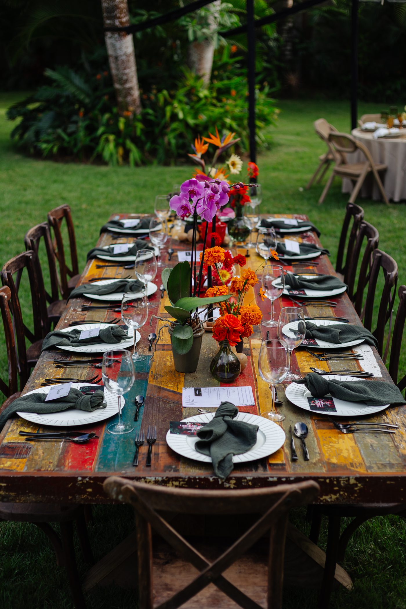 Colorful reclaimed wood table with orchids